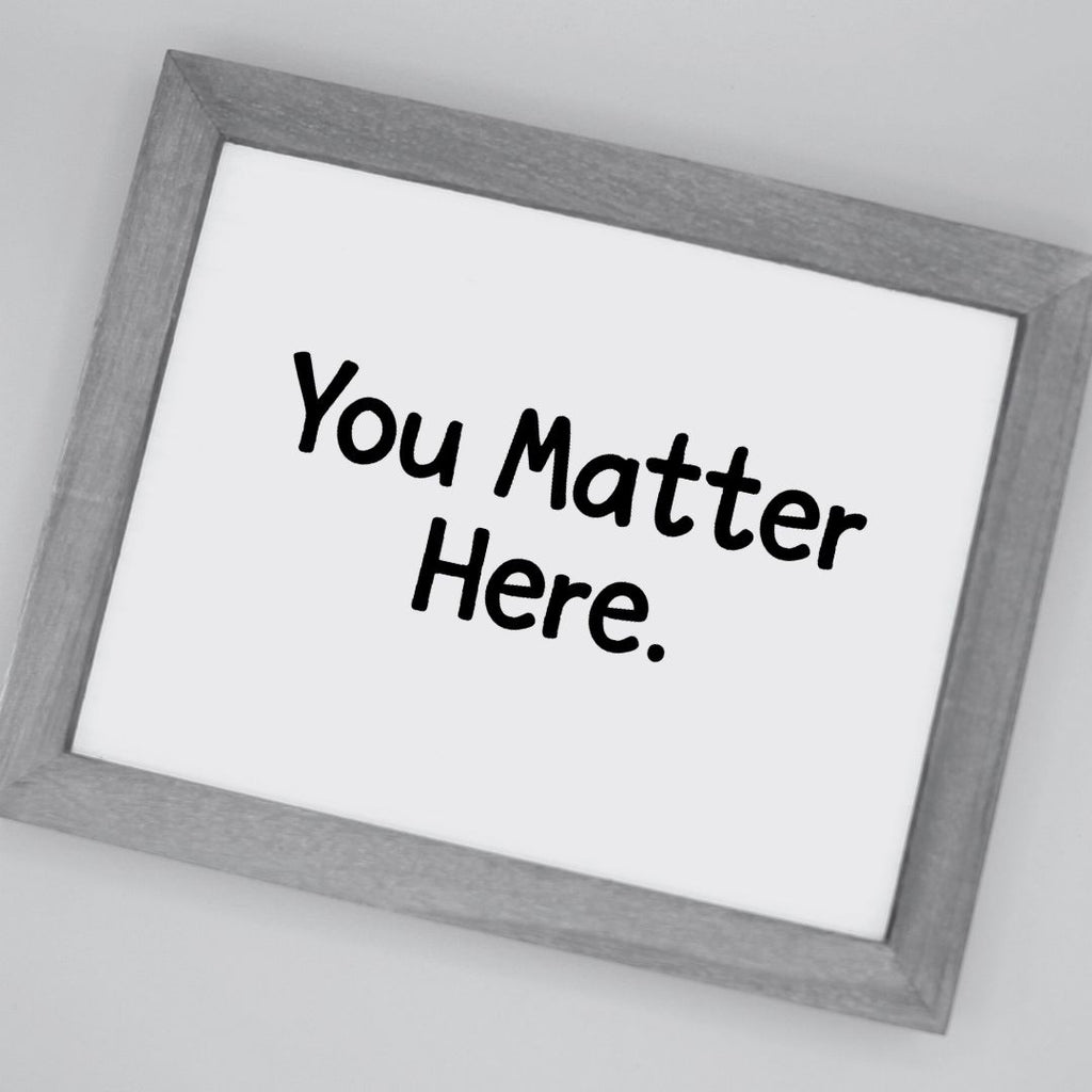 Framed poster with 'You Matter Here' text on a white background