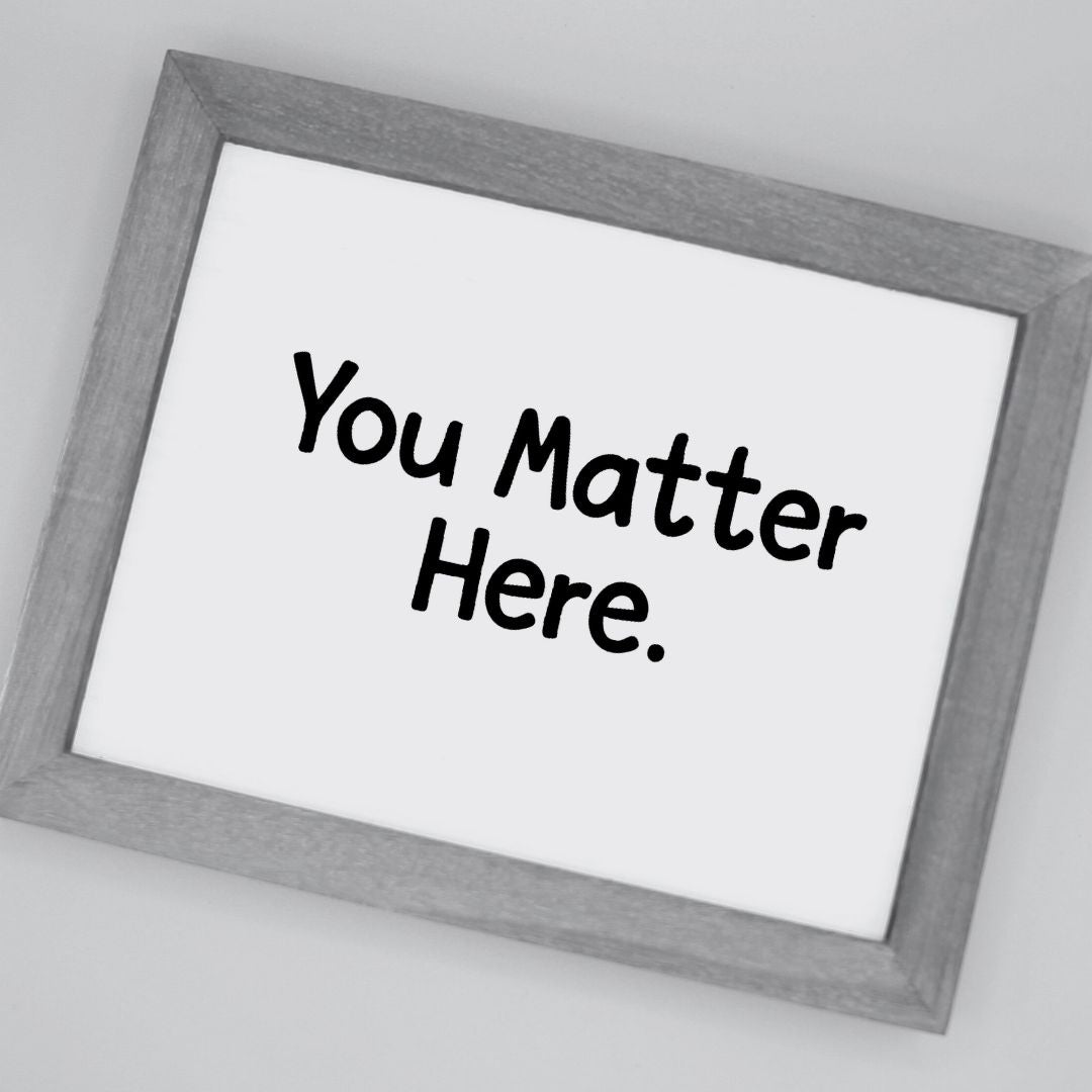 Framed poster with 'You Matter Here' text on a white background