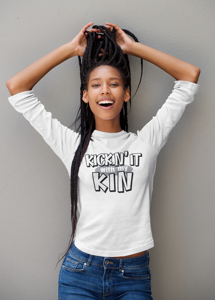 woman with white long sleeved shirt displaying the kickin it with my kin design