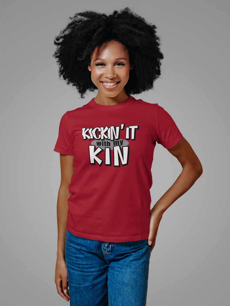 woman with red short sleeved shirt displaying the kickin it with my kin design